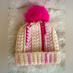 Crocheted Children’s pink and white winter hat with pink Pom Pom